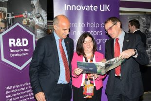 Derek Allen, Innovate UK, with Melanie Brownridge and Adrian Simper at R&D stand