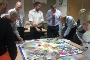 Sellafield Ltd team learning about asset management by playing the Synergy Board Game