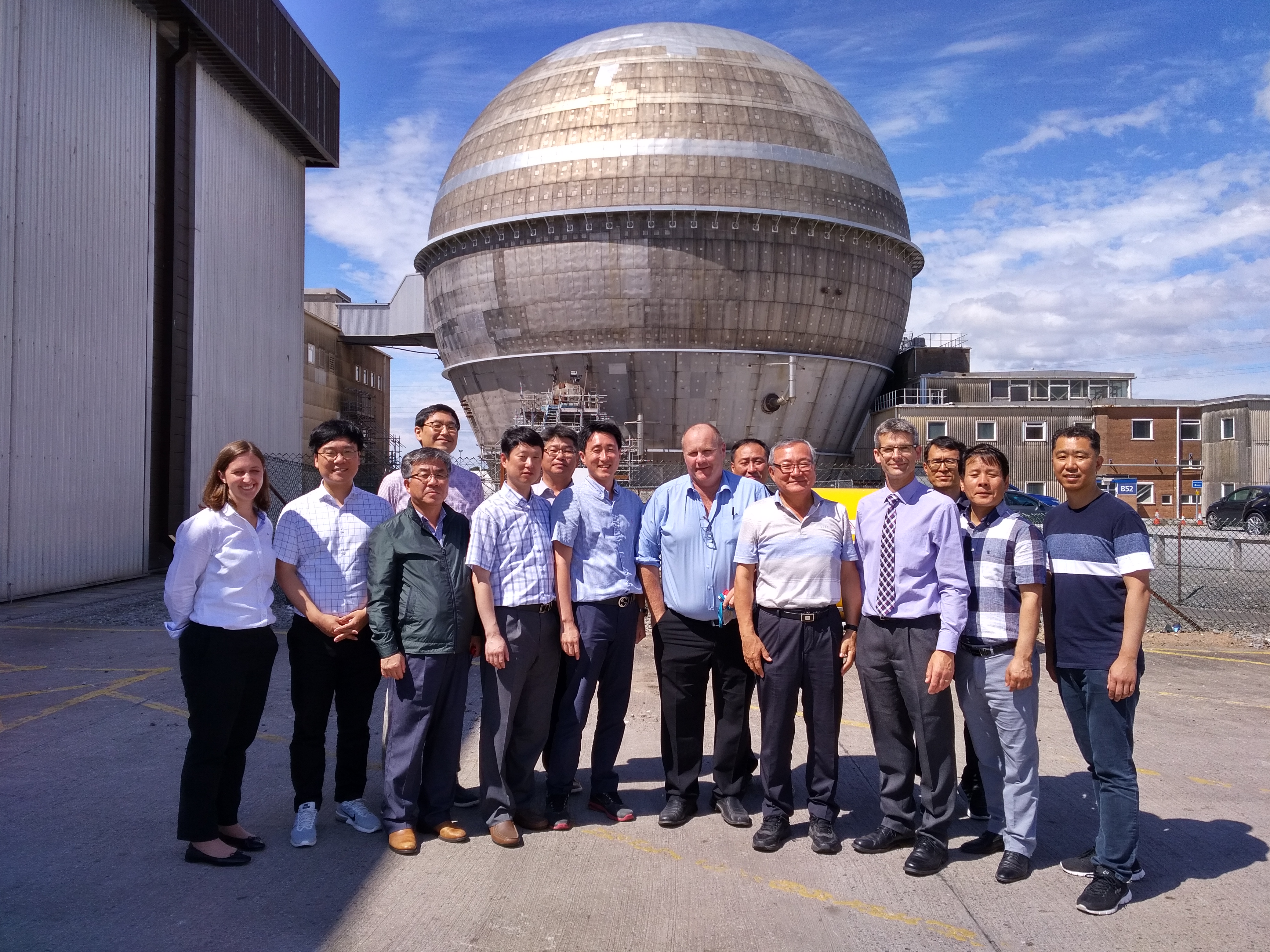 Korean visitors and hosts outside Sellafield's Windscale Advanced Gas-Cooled Reactor (WAGR)