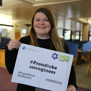 Joanne Griffen holding sign that says Proud to be an engineer, transform the future #INWED19