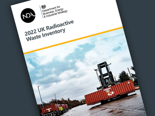 Front cover of the report showing an image of some low level waste being moved on site and NDA logo on top left