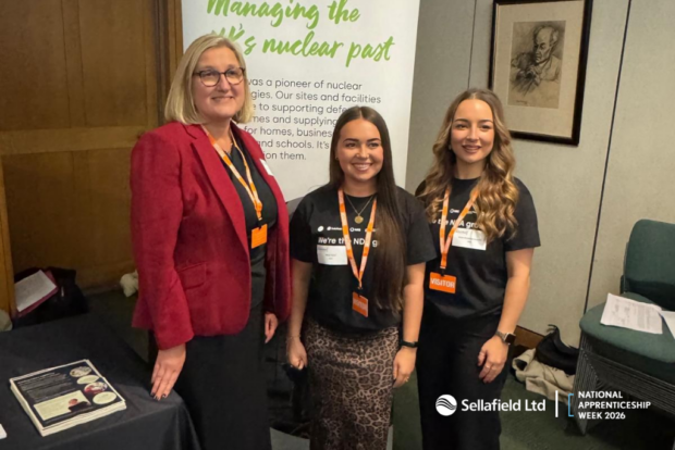 Nic Westcott, Sellafield Ltd standing with two apprentices at a networking event