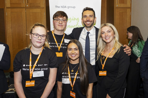 Holly and two other apprentices stood with Josh McAllister MP at Nuclear Week in Parliament